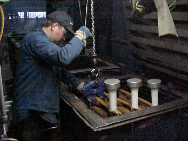 The mould shells are loaded into a box mould.