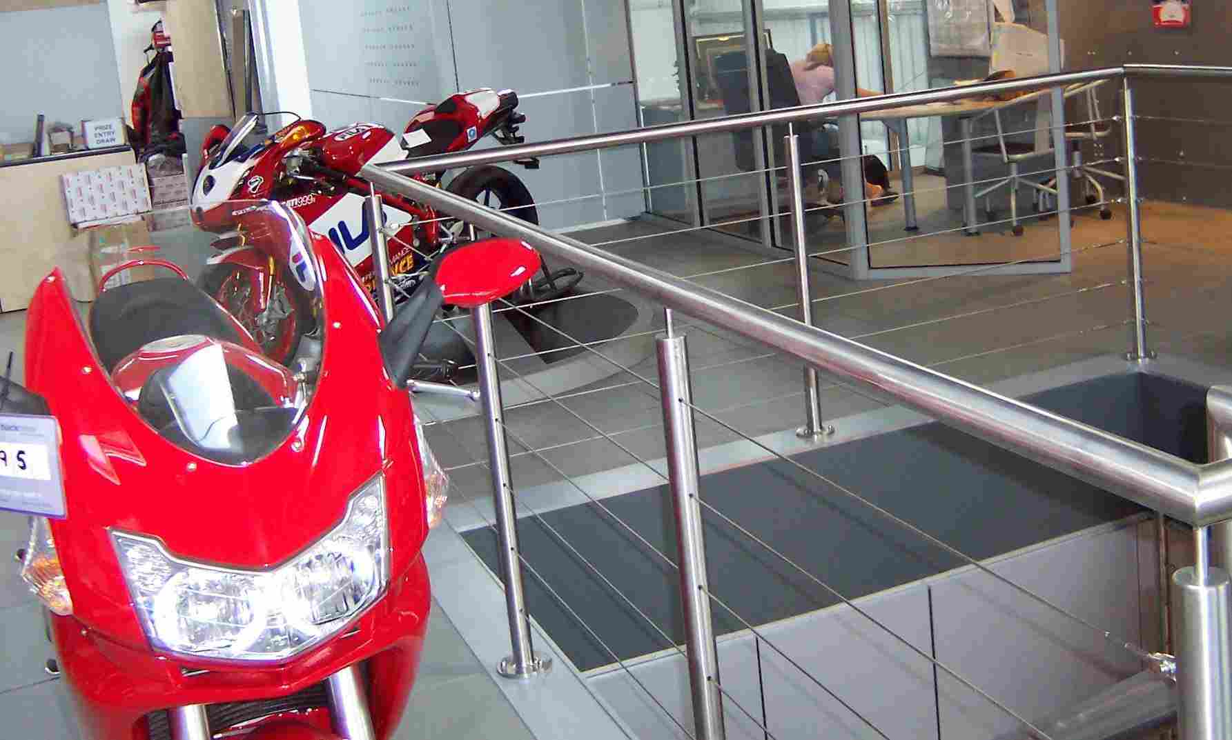 Stainless steel  wire balustrade in a motorcycle showroom.